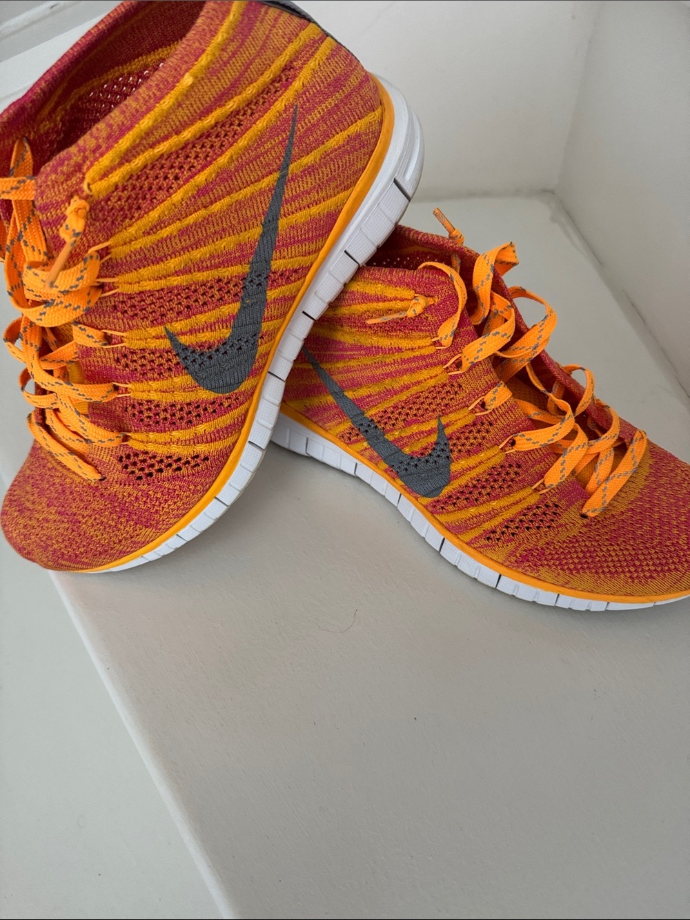 Nike Flyknit Sneakers in Orange and Red with Gray Swoosh